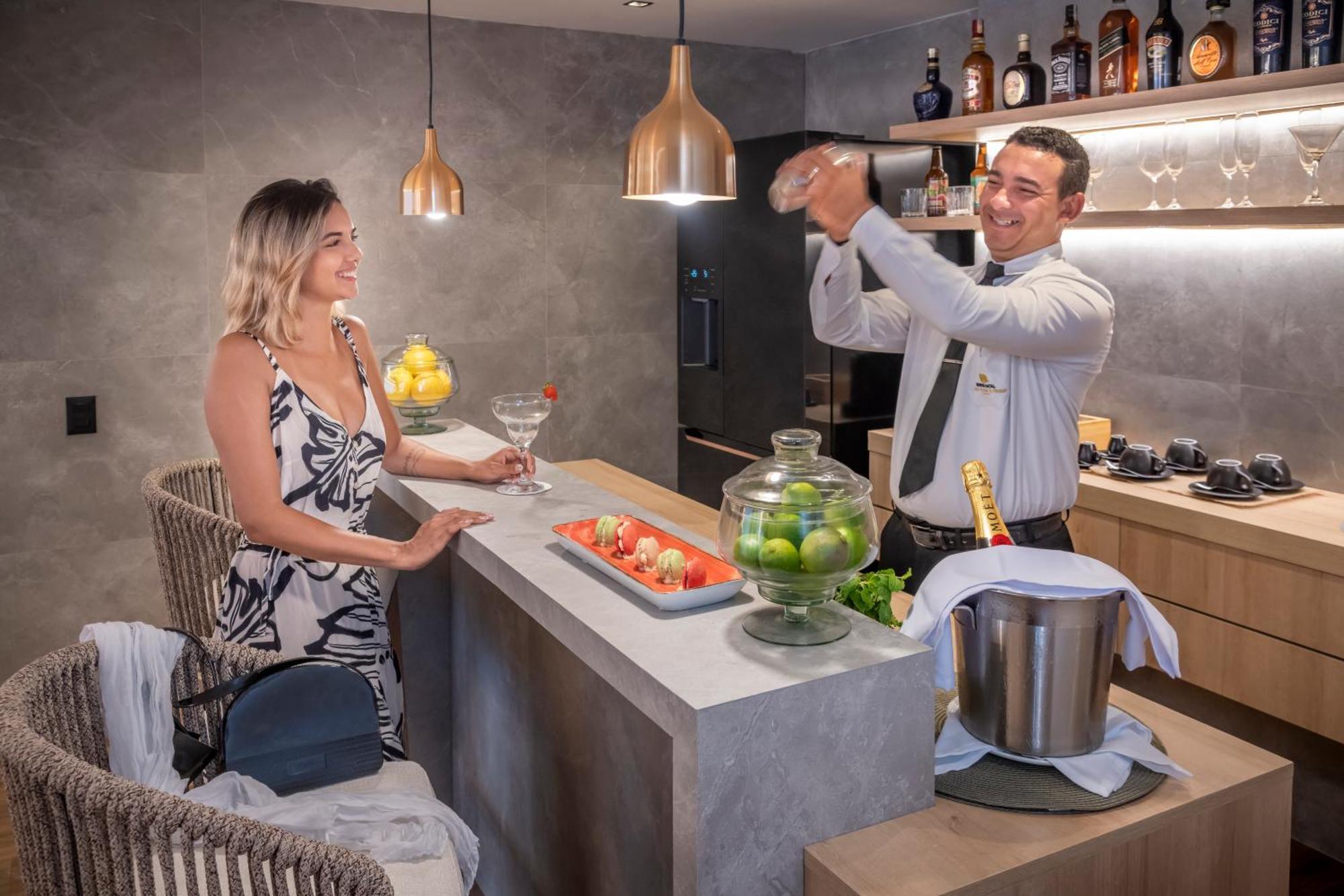 Serhs Natal Grand Hotel & Resort Экстерьер фото A bartender at work